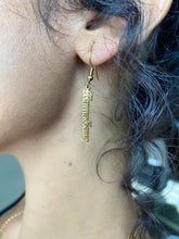 Hanging logo earring